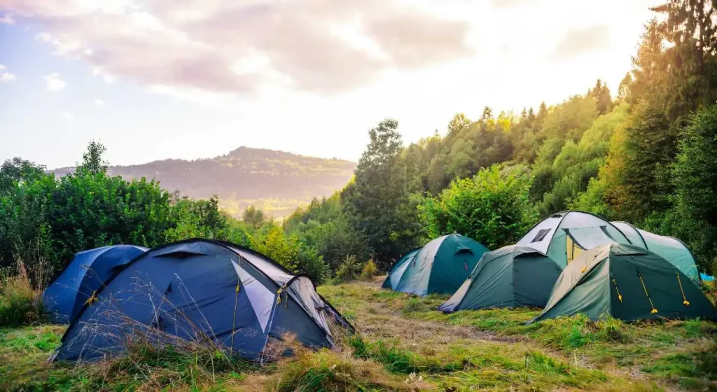 Even though camping as a cowboy typically means sleeping outside, it's a good idea to bring a backup tent